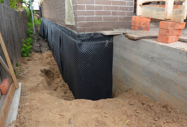 SJ Waterproofing Pros technician performing targeted Basement Waterproofing assessment in Norwich, NY